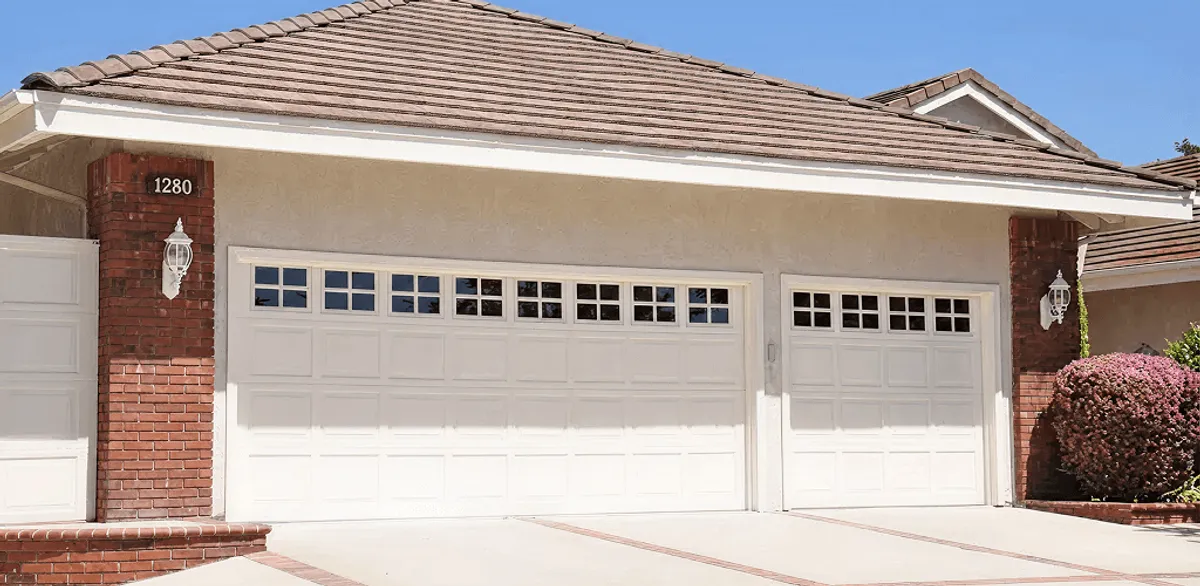 Residential garage door repair service for a double garage door in Omaha, NE