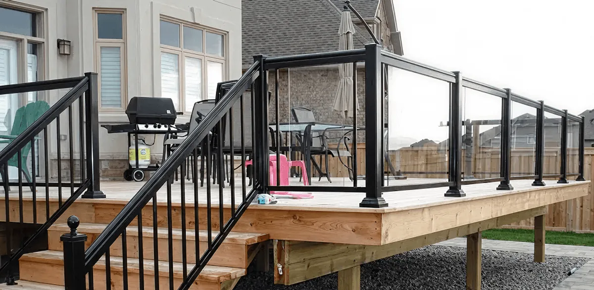 Handrail installation on a deck staircase for safety and code compliance in Omaha, NE