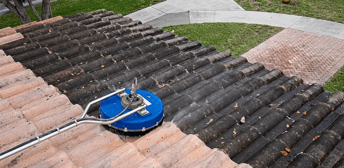 Roof pressure cleaning removing debris and buildup from roof tiles in Omaha, NE